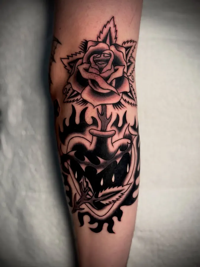 Black rose and snake tattoo.