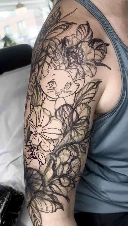 Cat surrounded by flowers in black and grey.