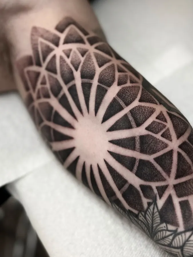 Black geometric pattern tattoo.