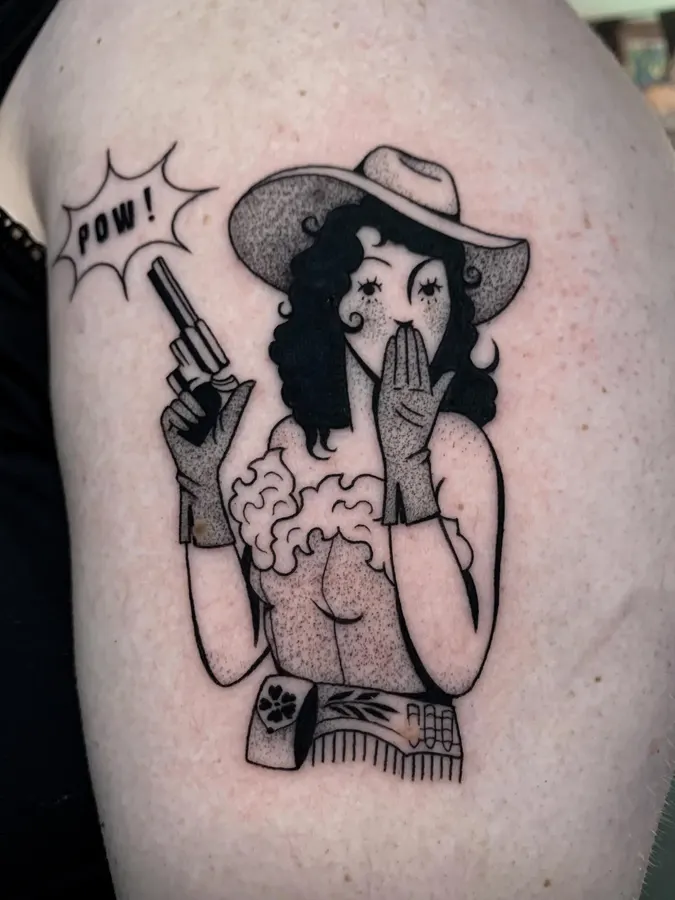 Illustrative cowgirl character tattoo.