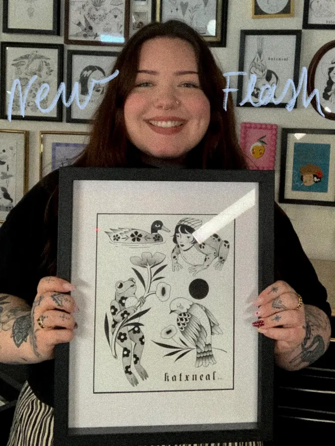 Kat presents one of her framed illustrations.