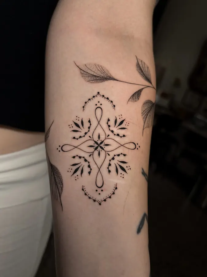 Fine-line floral and ornamental design.